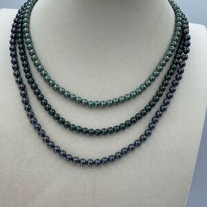 Three strand faux black pearl layered necklace.